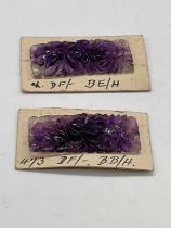 An unusual pair of floral carved amethyst plaques mounted on card, 36 x 18mm.