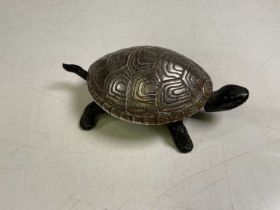 An early 20th century cast iron German table bell modelled as a tortoise, length 14.5cm.