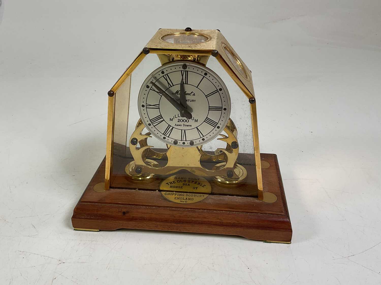 A Michael's 21st Century Millennium 2000 brass skeleton clock, with glazed and brass case and oak