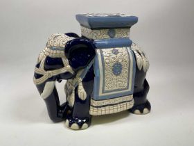 A ceramic elephant plant stand, height 42cm.