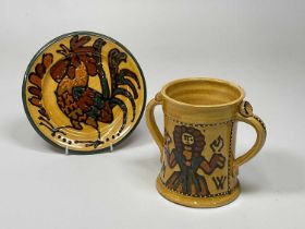 † MARY WONDRAUSCH; a slip glaze twin handled cup set with the artist's initials and inscribed 'The