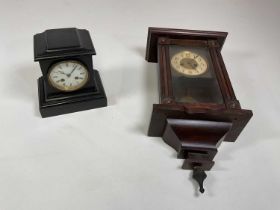 A slate mantel clock and a wall clock