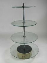 A 1930s Garrard revolving four tier shop display stand, the electric motor powered revolving base
