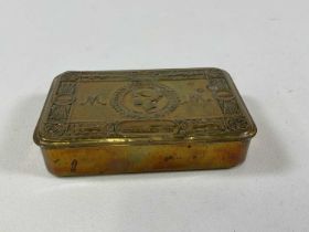 A Queen Mary WWI Christmas tin containing card, remnants of the tobacco pouch and two rather