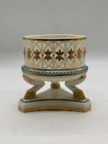 GRAINGER & CO, WORCESTER; a small reticulated pot raised on three goat hoof supports and