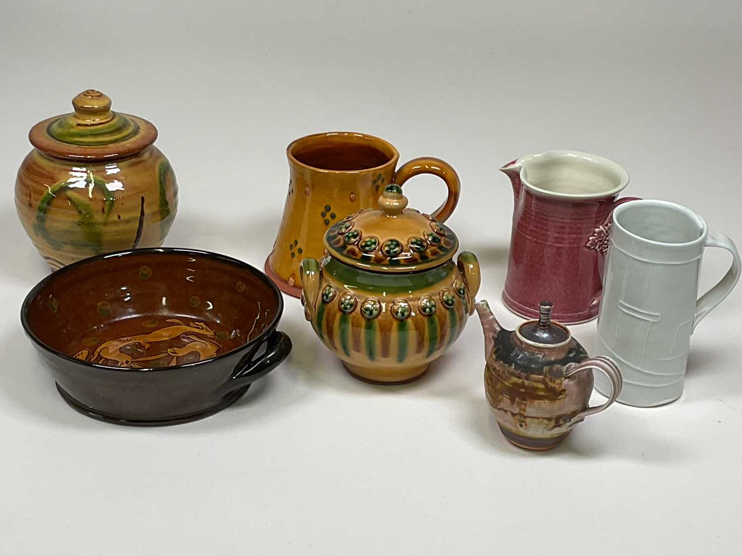 † A small group of studio ceramics including a Clive Bowen slip glaze decorated vessel and cover,