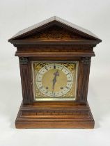 WINTERHALDER & HOFMEIER; an early 20th century oak cased mantel clock, with architectural columns