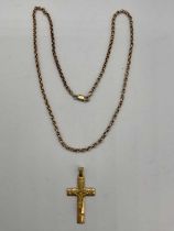 A 9ct yellow gold hoop link chain, length 52cm, and an 18ct yellow gold crucifix pendant, length