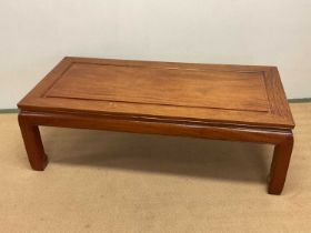 GEORGE ZEE; a Chinese hardwood coffee table, height 42cm, width 128cm, depth 62cm.