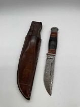 A Wade and Butcher hunting knife with leather sheath, length 22.5cm