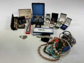A collection of costume jewellery including two amber rings, brooches, fashion watches etc, also a