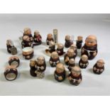 A collection of Goebel monks including a cruets, a timer, napkin rings, bottle stop, thermometer and