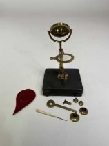 A late George III lacquered brass travelling microscope, unsigned and in shagreen case.