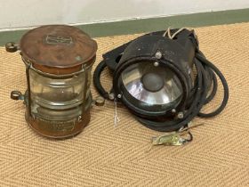 A Naval Aldis lamp and a brass ship's mast light.