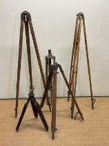 Five various tripod stands of varying sizes, constructed of wood and various metal, comprising ERW &