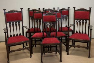 A set of eight (6+2) oak Arts and Crafts chairs, carvers 121 x 59 x 45cm, dining chairs 114 x 41x