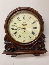 A late 19th century oak cased wall clock with fusée verge movement, the painted dial set with