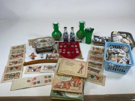 A collectors' lot, including cigarette cards, archery medals, postcards, WW1 silks and other items.