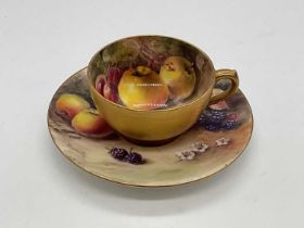 ROYAL WORCESTER; a fruit painted cup and saucer decorated with blackberries and apples. Saucer