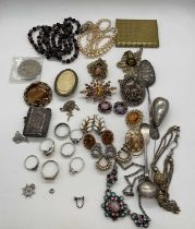 A group of costume jewellery including rings, Albertina chain, silver vesta case, silver spoon etc.