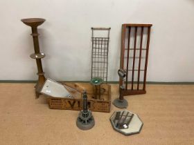 A quantity of assorted items, to include a brass candle stand, two racks, a wooden advertising