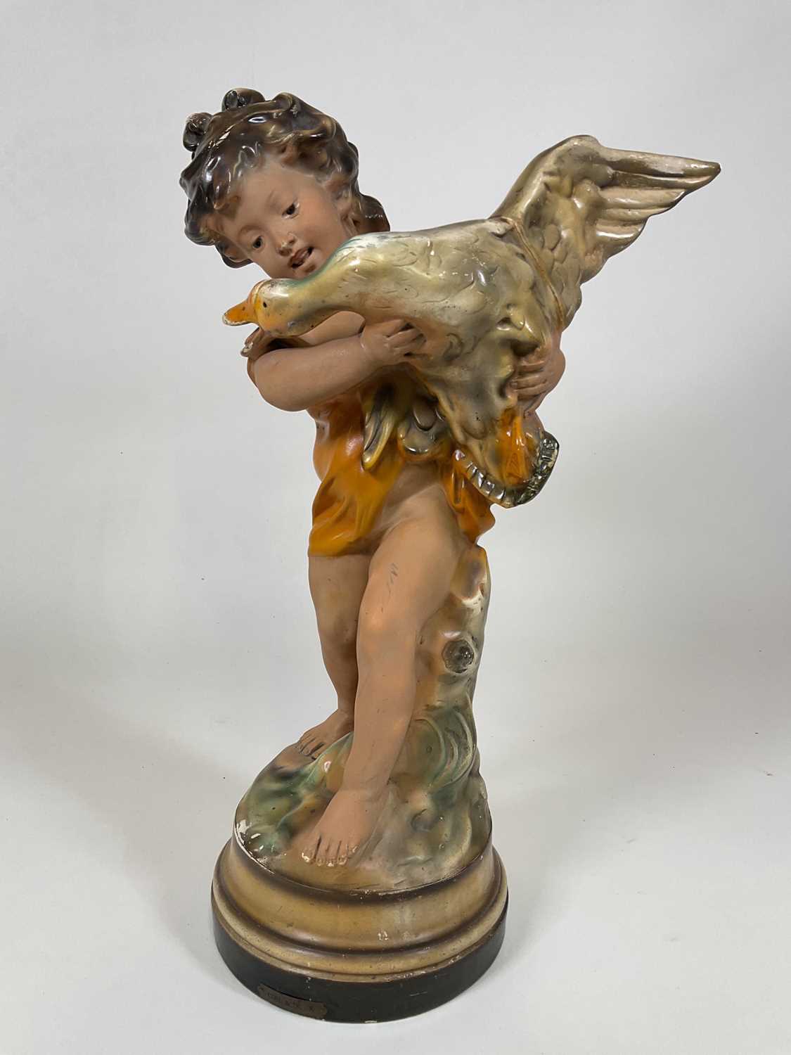A large chalk statuette with plaque to base 'Girl & Duck', ref 272, height 63cm,( In original