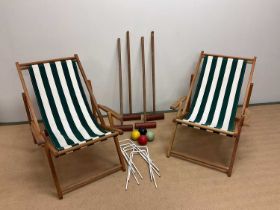 A pair of deck chairs and a part croquet set