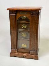 NELSON INTEREST; an oak miniature tabletop cabinet with twin Ionic pilasters flanking an arched