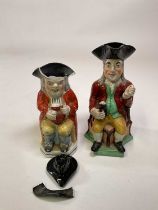 An early 19th century Staffordshire toby jug and similar traditional jug with tricorn hat a/f (2)