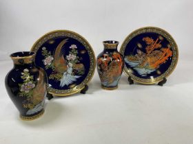 Blue lacquer ceramics comprising two vases, one with a tiger and one with pheasants, and two similar