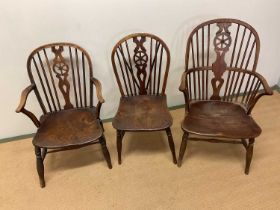 A mid 19th century ash and elm hoop back Windsor elbow chair, a similar small example and a