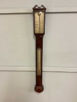 WATKINS & HILL OF LONDON; an early 19th century mahogany stick barometer with silvered dials, height