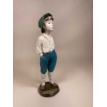 A chalk plaster statue figure of a whistling boy, later painted, height 60cm.