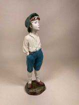 A chalk plaster statue figure of a whistling boy, later painted, height 60cm.