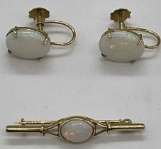 A pair of 18ct yellow gold and opal screw back earrings and a matching bar brooch, length of