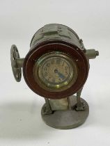 An early 20th century novelty timepiece in the form of a searchlight, with Arabic numerals to the