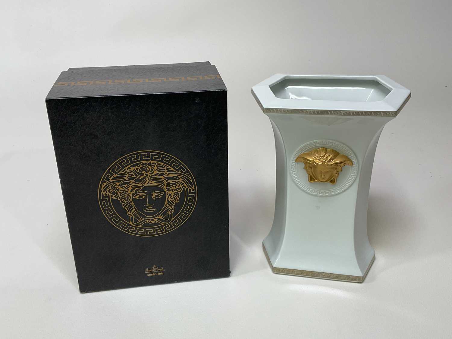 VERSACE FOR ROSENTHAL; a boxed porcelain vase with raised relief heads on opposite sides, height