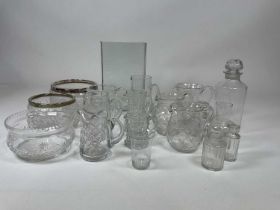 A quantity of vintage cut and moulded glass items including jugs, bowls, and other items.