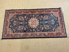 A Persian rug, 178 x 90cm.