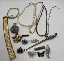 A collection of costume jewellery to include some silver items, a rolled gold bangle, a pocket watch
