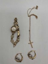A pair of 9ct two tone gold dolphin earrings, a fine link 9ct gold chain suspending a cross, and a
