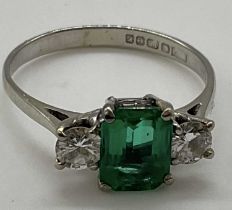 An 18ct white gold emerald and diamond ring, the emerald cut emerald weighing approx 1.25ct