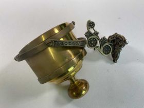 A counter weight cantilever ship's brass candle holder designed to swivel and stay level with the