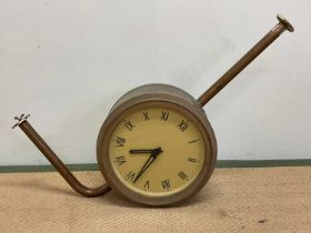 A mid 20th century double sided brass and glazed cased industrial wall clock, the dial with Roman
