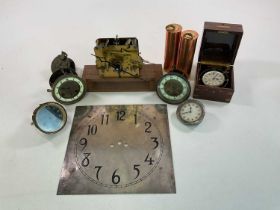 A quantity of clock movements and parts for spares and repairs, including weights, faces, and