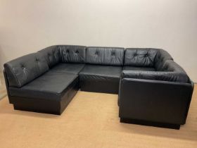 A mid 20th century 1970s Danish black leather five seat corner sofa, which separates into five