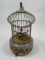 An early 20th century two bird automaton singing musical birdcage with painted detail to the