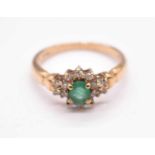 A 9ct yellow gold emerald and diamond floral cluster ring, size M, approx. 2.27g.