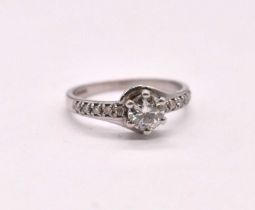 A 9ct white gold diamond solitaire ring, the six claw set round brilliant cut principal stone set