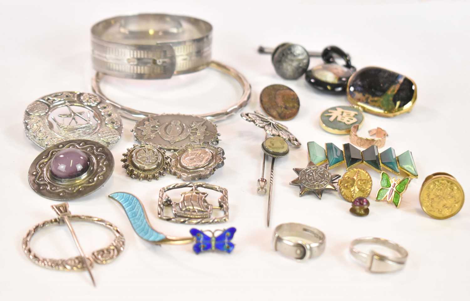 A group of predominantly costume jewellery, including silver Celtic inspired brooches, a cut 9ct